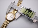 Digital caliper measuring the case diameter of the Seiko watch, showing a precise reading of 37.01mm.