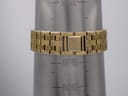 Gold-tone steel bracelet of the Seiko V743-8069 watch measured on a wrist sizing gauge, showing a circumference of 18.8cm.