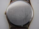 Close-up of the brushed stainless steel case back, clearly showing 'SEIKO SGP BACK ST. STEEL 181510 7122-7000 R JAPAN-A' engravings.