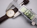 Digital caliper measuring the case diameter of the Seiko watch, displaying a precise measurement of 31.78mm.