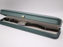 The Orient UNBH-CO watch displayed inside a green watch presentation box.
