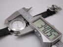 Digital caliper measuring the case diameter of the Gc watch at 34.05mm, with the strap extended.