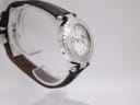 Opposite side perspective view of the Gc watch on a stand, highlighting the case profile and strap connection.