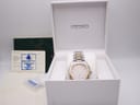 Seiko 5M42-0B80 two-tone watch in its original white Seiko box, with a green Goldsmiths guarantee card and instruction papers.