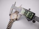 Digital caliper measuring the case diameter of the Seiko watch, showing a precise measurement of 38.18mm.