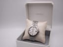 Front view of Seiko Kinetic watch on cushion inside original Seiko box.