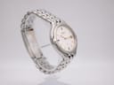 Another side view of Seiko Kinetic watch on a stand, highlighting the brushed and polished case finish.