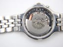 Close-up of the Seiko 5M42A kinetic movement visible through an open case back.