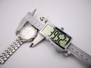 Seiko Kinetic watch being measured with a digital caliper showing 39.52mm case diameter.