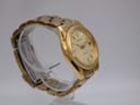 Another angled view of the gold Seiko Kinetic watch, highlighting the bracelet and dial.
