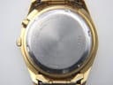 Close-up of the watch's stainless steel case back showing model number 5M42-0H20 and serial number 910466.
