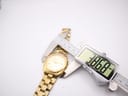 Digital caliper measuring the case diameter of the Seiko watch, displaying 38.69mm.