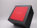 Top-down view of the closed black and red presentation box with "SEIKO" embossed on the red insert.