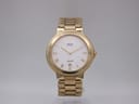 Front view of the gold-toned Seiko SQ100 quartz watch with a white Roman numeral dial and date window.