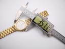 Overhead shot of the watch on a white background with a digital caliper measuring the case diameter at 35.1mm.