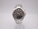 Front view of Seiko Kinetic 5M62-0AK0 two-tone watch with dark grey dial and gold-tone baton indices.