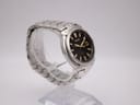 Another angled side view of the Seiko watch highlighting the gold-tone crown and pusher.