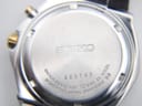 Close-up of the watch case back showing Seiko branding, serial number 323745, model 5M62-0AK0, and 10 BAR water resistance.