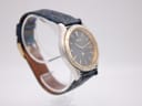 Left side angled view of the Seiko Kinetic watch, highlighting the polished stainless steel case profile and strap texture.