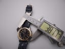Digital caliper measuring the case diameter of the Seiko Kinetic watch at 38.17mm from an oblique angle.