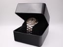 The two-tone Seiko Kinetic watch displayed neatly inside a generic black presentation watch box on a cushion.