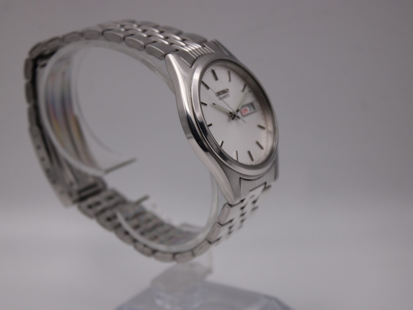 Another angled side view of the Seiko watch, highlighting the polished bezel and brushed case sides.