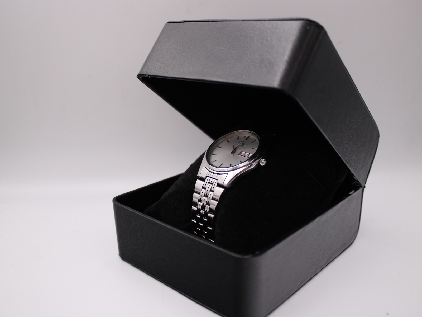 Seiko watch displayed within a black, non-original presentation box.