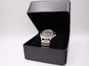 The Seiko Kinetic watch presented in a black watch box on a velvet cushion.