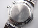 Close-up of the watch case back, showing 'SEIKO STAINLESS STEEL 5M43-0E90 A0 WATER RESISTANT' and serial number '060595'.