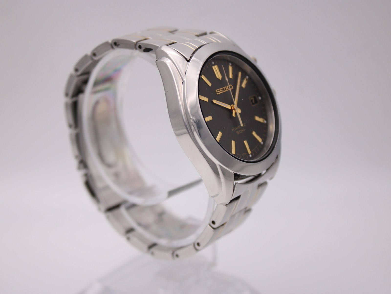 Another angled side view of the Seiko watch, highlighting the brushed and polished finish of the case.