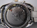 Macro shot revealing the Seiko 5M62A kinetic movement with its oscillating weight and jewels.