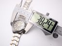 Digital caliper measuring the case diameter of the Seiko watch, showing a reading of 38.24mm.