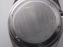 Close-up of the brushed stainless steel case back with "SEIKO", "WATER RESISTANT", "STAINLESS STEEL", "182981", and model number "7009-3130" engravings.