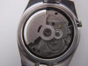 Close-up view of the Seiko 7009A automatic movement inside the watch, showing the rotor and gears.