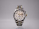 Front view of Seiko 5M43-0F30 kinetic watch with white dial and two-tone bracelet.