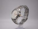 Angled side view of the Seiko kinetic watch showing case profile and gold-tone crown.