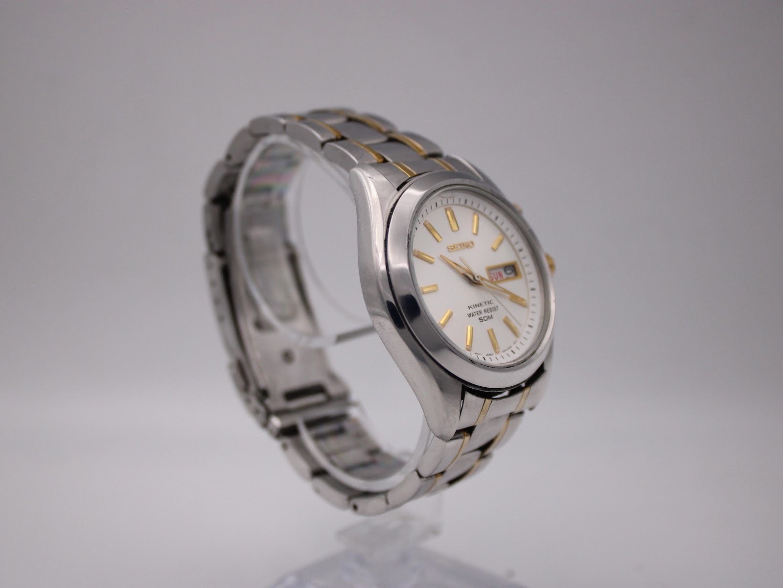 Opposite angled side view of the Seiko watch, highlighting the two-tone bracelet.