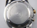 Close-up of the watch case back showing model number, serial number, and 5 BAR water resistance.