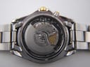 Close-up of the Seiko 5M43A kinetic movement visible through the display case back.