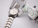 Digital caliper measuring the case diameter of the Seiko watch at 40.05mm.