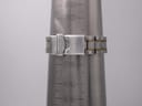 Seiko two-tone bracelet clasp closed on a wrist sizing gauge, showing 188mm circumference.