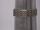 The watch bracelet on a wrist sizing gauge, showing the internal circumference of 183mm (18.3cm) with the signed Seiko clasp closed.