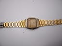 Full view of the SEIKO H448-5000 watch laid flat, displaying the bracelet from end to end.