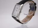 Side view of the Citizen Eco-Drive watch on a display stand, highlighting the polished silver case and crown.