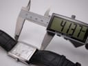 Close-up of a digital caliper measuring the lug-to-lug length of the Citizen watch case, displaying 41.37 mm.
