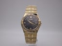 Frontal view of the gold-tone Citizen Eco-Drive watch with black dial and stone-set bezel.