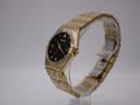 Angled side view of the Citizen Eco-Drive watch on a clear stand, showing the bracelet and clasp.