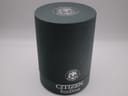 The closed original cylindrical grey box for the Citizen Eco-Drive watch.