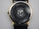 Close-up of the stainless steel case back of the Citizen watch, showing 'Citizen Watch Co. Water Resist Base St. Steel Eco-Drive' engravings and serial number 920422, with some surface scratches.