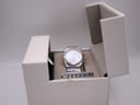Front view of the Citizen Eco-Drive watch in its original white box, angled slightly.